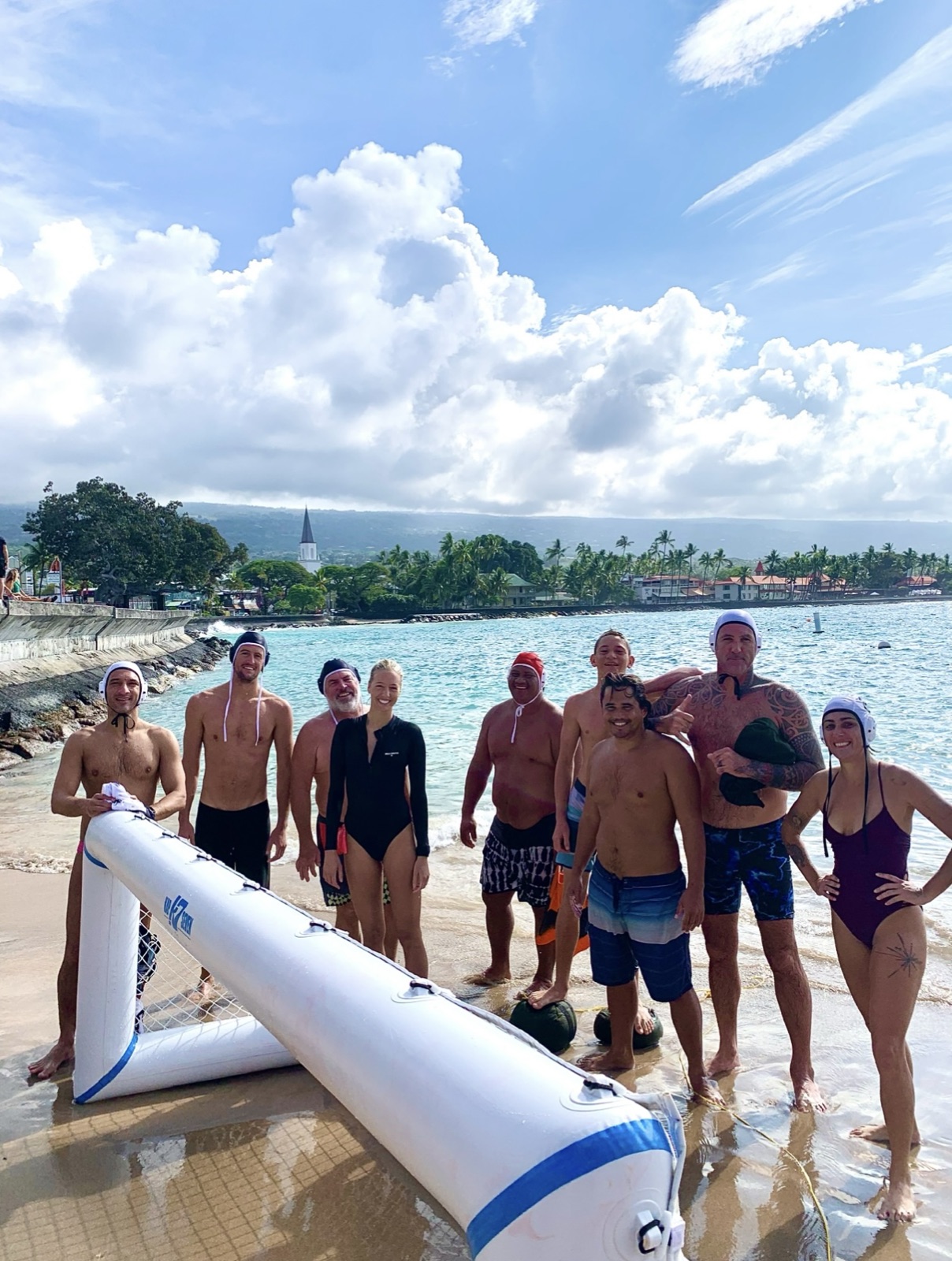 Players gathered on the beach at Kona Pier