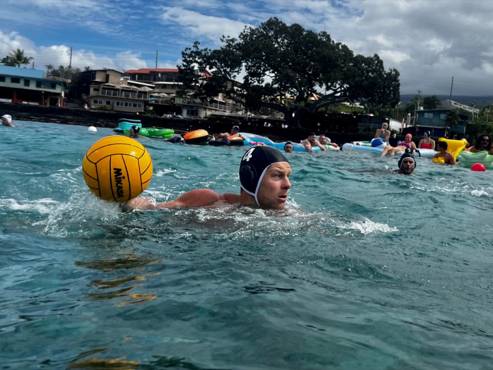 A player moving the ball during an open-water game at Kona